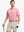 Model wearing Modern Texture Stylish Polo in CARMINE, front half-body view holding golf club.