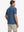 DARK BLUE STRIPE Classic Heather Stripe Polo back half-body view of model