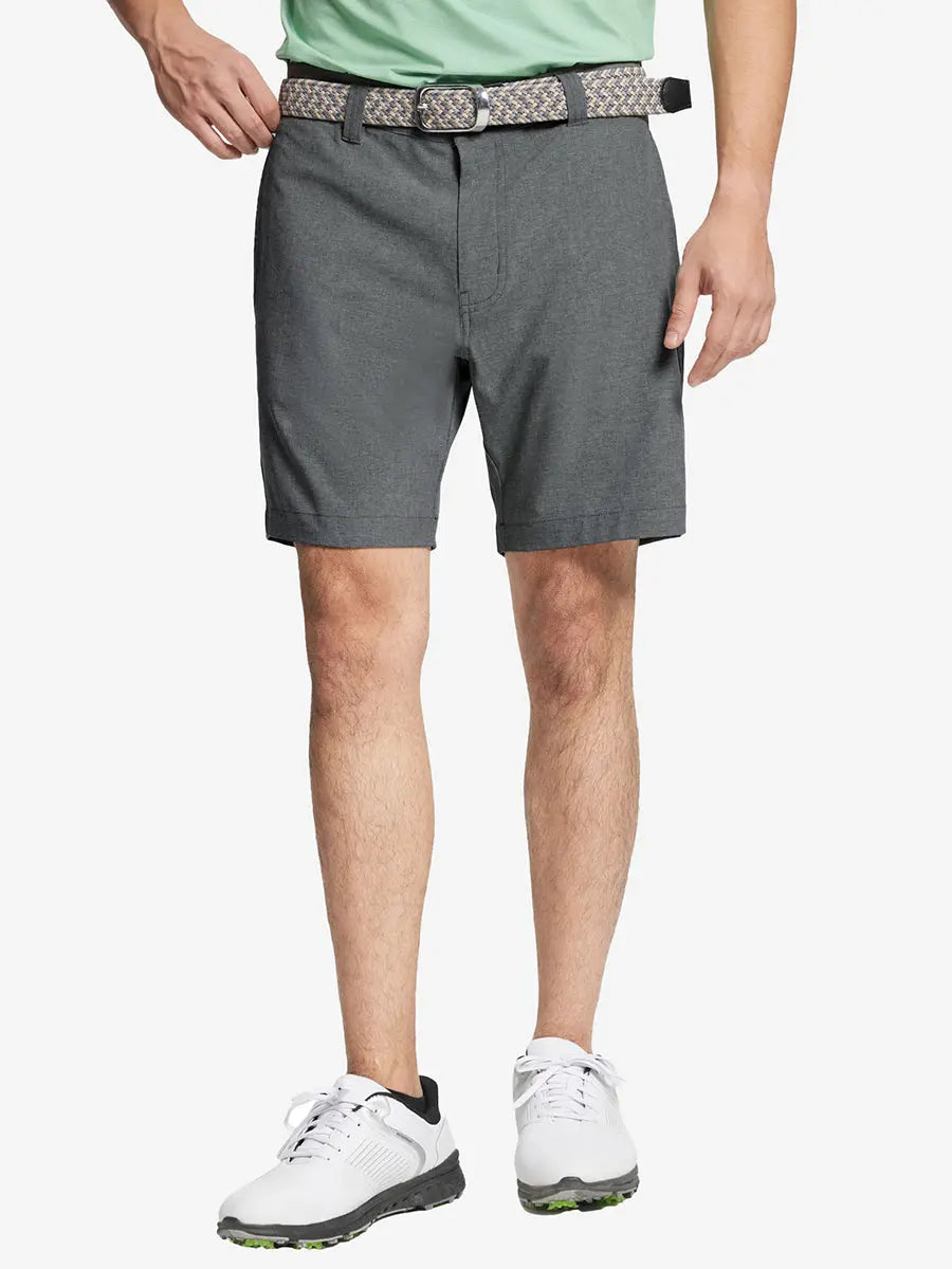 DARK GREY 7 Inch Heather Performance Golf Shorts with front view, model's lower body and side pockets visible
