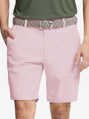 Front waist to knee view of pink water resistant golf 9 inch shorts, clean athletic fit.
