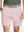 Front waist to knee view of pink water resistant golf 7 inch shorts, clean athletic fit.