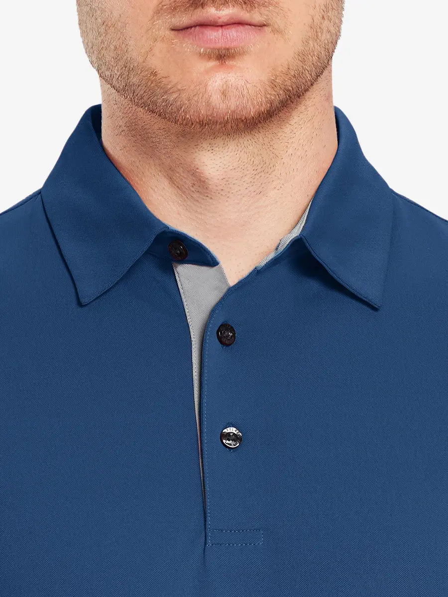 Model wearing the blue long sleeve pique polo, emphasizing its modern design and comfort.