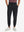Model wearing Lightweight Ankle-Zip Sweatpants with 4 Pockets in black, lower body front view