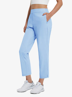 Front lower-body view of model with right hand in pocket wearing LIGHT BLUE Women's 7/8 Ankle Golf Track Pants.