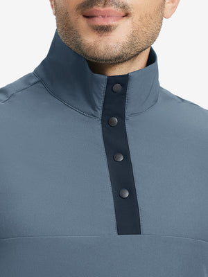 Close-up from nose to chest, highlighting buttoned collar and textured fabric of the misty blue pullover.