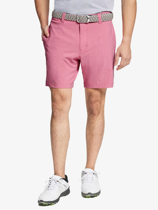 PINK 7 Inch Heather Performance Golf Shorts with front view, model's lower body and side pockets visible