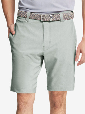 Front view of youth wearing glacier grey Heather Performance Golf Shorts, showing fit and style