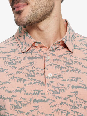 Front half-body view from nose to chest of model wearing LIGHT ORANGE MASSIF Popular Heather Print Polo