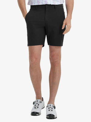 Front view of model’s lower body with hands in pockets, wearing Player Fit Versatile Solid Shorts – BLACK