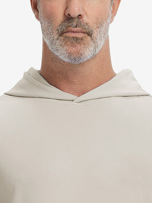 Close-up from nose to chest, showing soft collar texture and stitching detail of the khaki light hoodie.