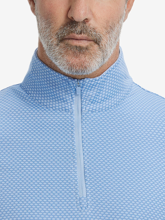 Close-up of collar area on jacquard quarter zip pullover in light blue, highlighting refined jacquard detail.