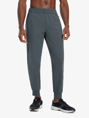 Front lower body view of model wearing DARK GREY Performance Tapered Sports Joggers