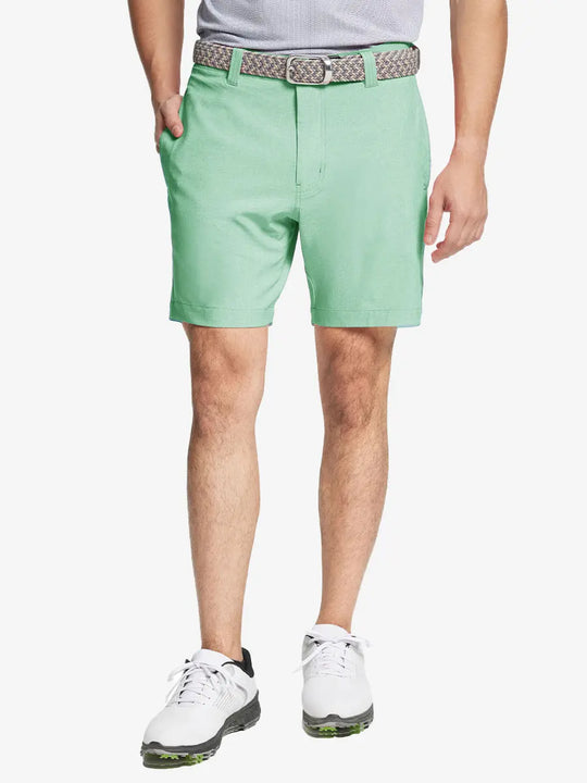 MINT GREEN 7 Inch Heather Performance Golf Shorts with front view, model's lower body and side pockets visible