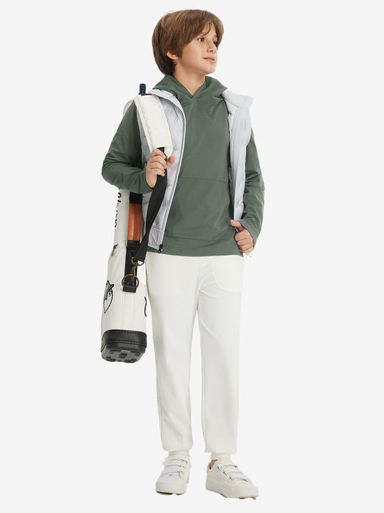 Model carrying golf bag, dressed in youth long sleeve hoodied with kangaroo pocket in olive green, full-body.