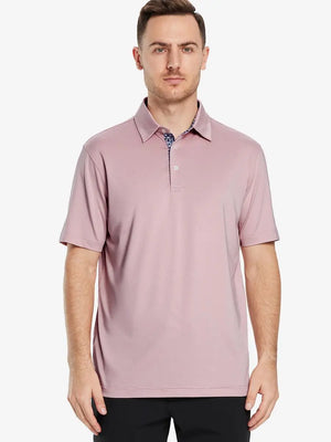 Front half-body view of male model in the Pale Pink Everyday Classic Solid Polo, standing still