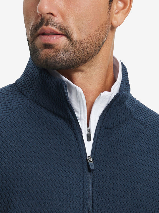 Close-up from nose to chest, highlighting collar detail of soft winter fleece jackets in navy.