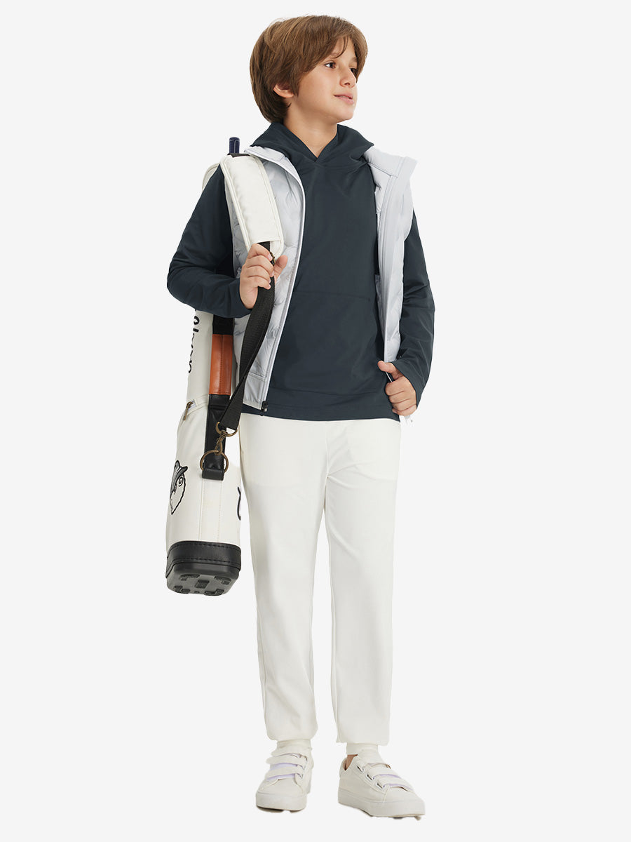 Model carrying golf bag, dressed in youth long sleeve hoodied with kangaroo pocket in dark grey, full-body.