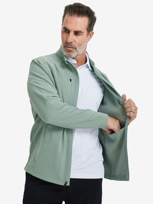 Model front half body lifting jacket, hand in inner pocket, textured insulated winter jacket, beryl green.