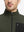 Close-up from nose to chest, showing collar detail of midweight warm stretchy quarter zip pullover in forest green.