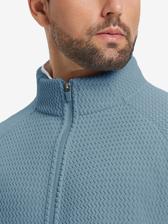 Close-up from nose to chest, highlighting collar detail of soft winter fleece jackets in misty blue.