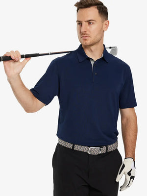 Half-body front pose with golf club in NAVY Ventilated Pique Performance Polo