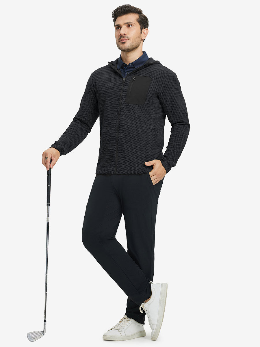Model holding golf club, dressed in full zip fleece hoodied jacket in black, sporty and casual.