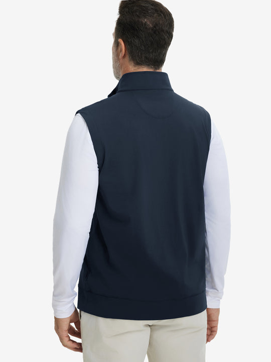 Back upper body view of the navy print collar quarter zip golf vest, clean cut and relaxed posture.
