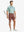 CRANBERRY 4-way Stretch Performance Solid Shorts, golfer full-body front with club, 7 Inch length