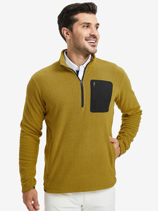 Model with one hand in side pocket, wearing midweight warm stretchy quarter zip pullover in yellow.