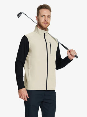 wearing the light khaki windproof golf vest, holding a golf club, emphasizing its lightweight design and zippered pockets.
