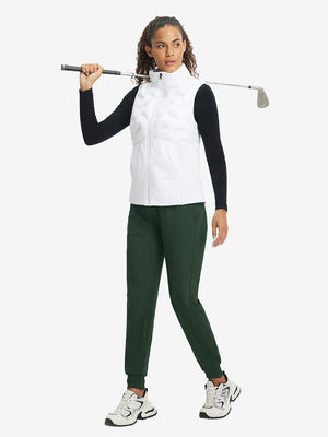 Full-body front view of model wearing women's stretch fleece lined water resistant joggers in forest green.