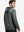 Back upper body view of the black melange classic heather hoodie, model turns head slightly with ease.