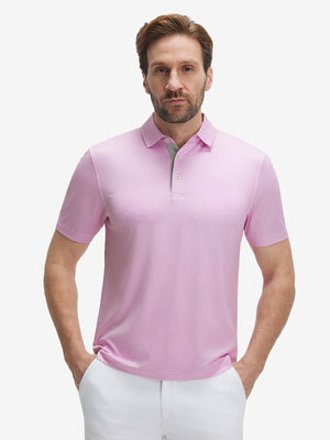 Front waist-up shot of model wearing pink white tee performance quick dry print golf polos