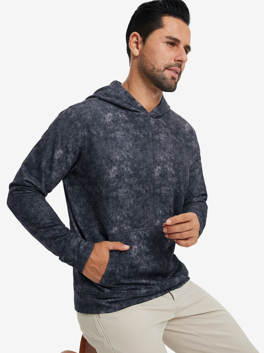 Model in navy exclusive print kangaroo hoodies with hands in pocket, relaxed front upper view.