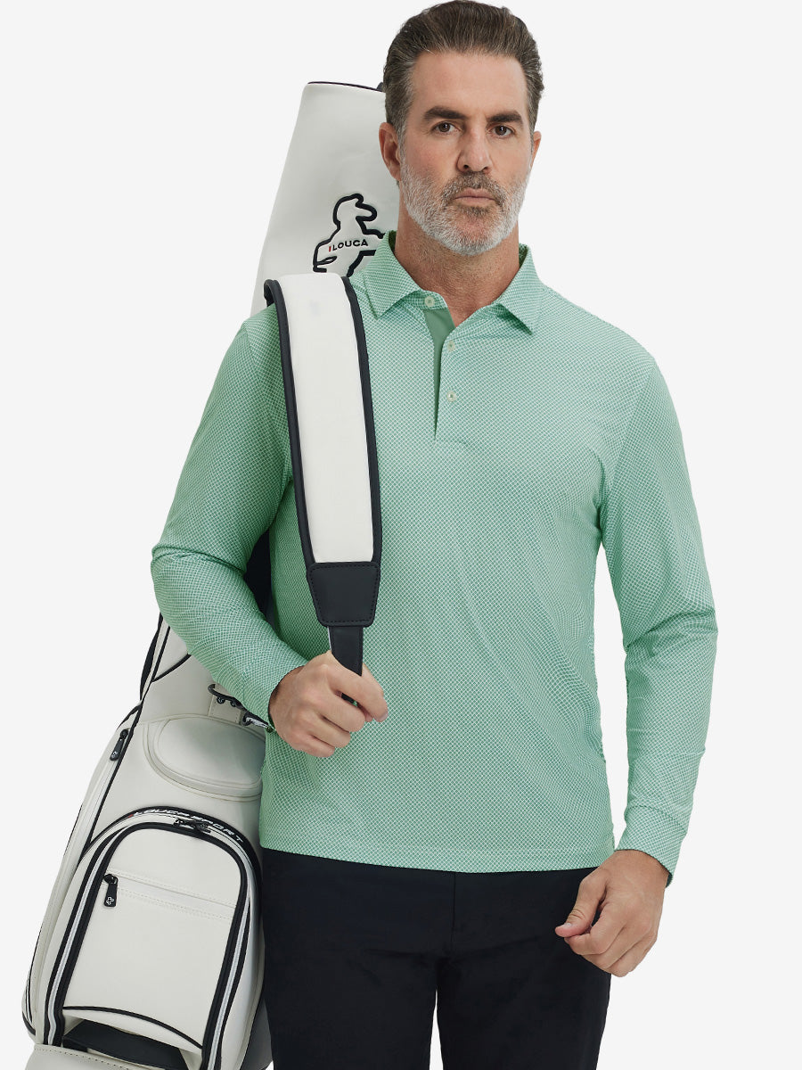 Model carrying golf bag, styled in green plant lightweight print long sleeve polo, sleek golf outfit.