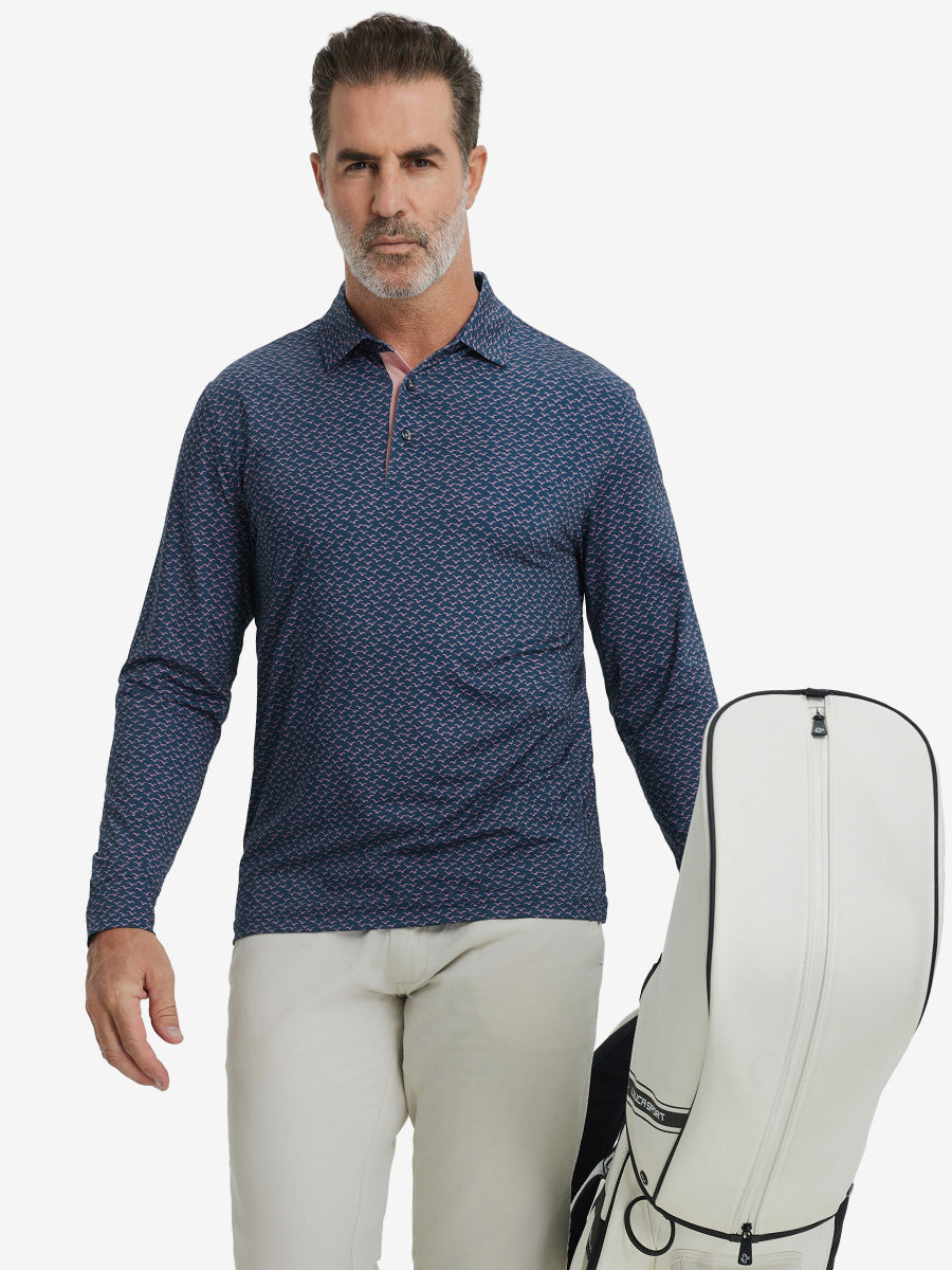 Model carrying golf bag, styled in navy pink seagull lightweight print long sleeve polo, sleek golf outfit.