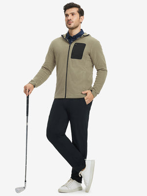 Model holding golf club, dressed in full zip fleece hoodied jacket in desert yellow, sporty and casual.