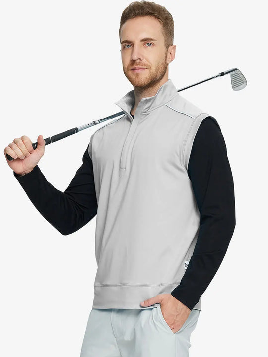Half-body front view of model holding golf club wearing TAUPE Stretch Solid Fleece Quarter-Zip Vest.								
