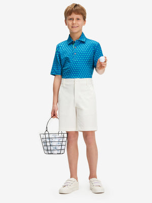 Full front: model in white boys lightweight dry fit flat front golf shorts holding golf club.