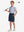 Full front: model in navy boys lightweight dry fit flat front golf shorts holding golf club.