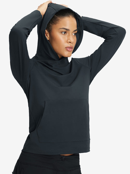 Model holding hoodie cap with both hands, wearing women's lightweight hoodies pullover in dark grey.