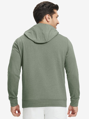 Back upper view of model in warm fleece golf hoodies pullover green.