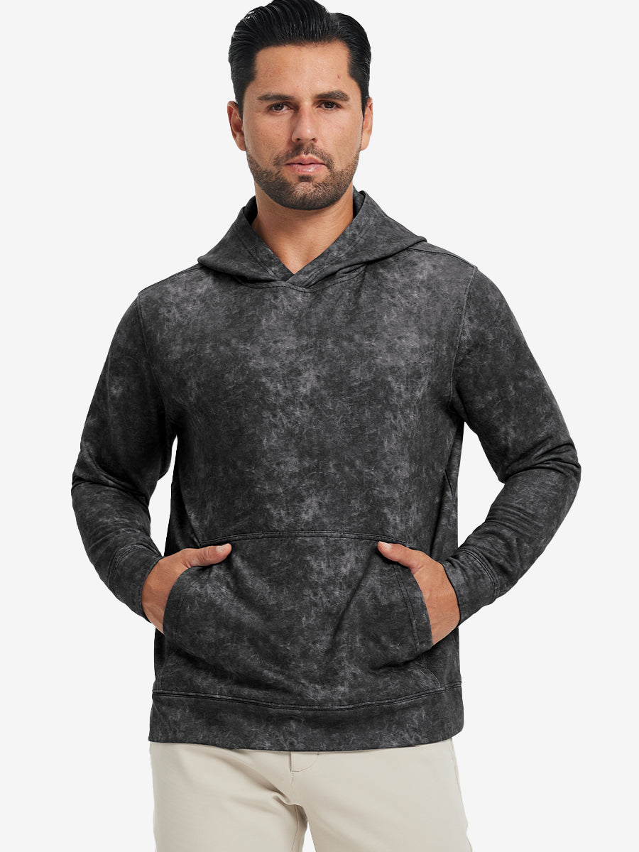 Model in black exclusive print kangaroo hoodies with hands in pocket, relaxed front upper view.