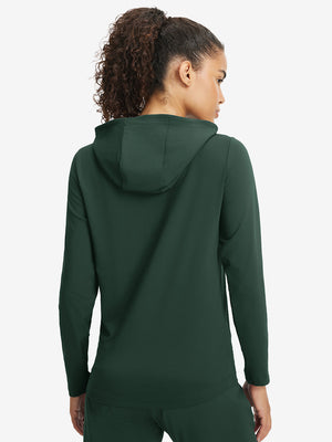 Back upper view of model in women's lightweight hoodies pullover, showing relaxed fit in forest green.