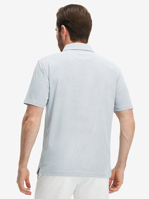 Back half-body view of a model wearing the navy feather weight jacquard polo shirts, highlighting the rear fit