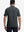 Back half-body view of model wearing the greystone heather comfy cotton blend polo shirt with pocket, highlighting the rear silhouette