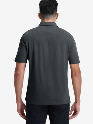 Back half-body view of model wearing the greystone heather comfy cotton blend polo shirt with pocket, highlighting the rear silhouette