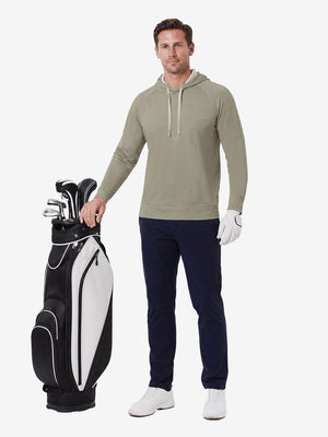 Full body model holding golf gear outdoors, heather midlayer golf hoodies in taupe heather