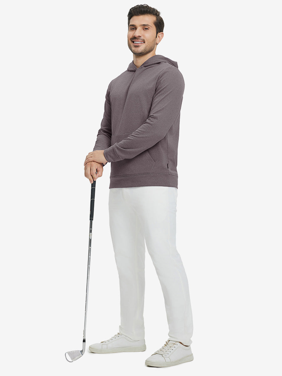 Model full-body view holding a golf club wearing warm fleece golf hoodies pullover indark red.