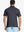 Back half-body view of Black Stripe Pinstripe Jersey Performance Polo worn by model								
